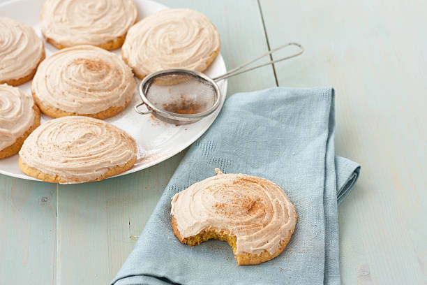 istock Pumpkin cookies with cream cheese frosting 472539428