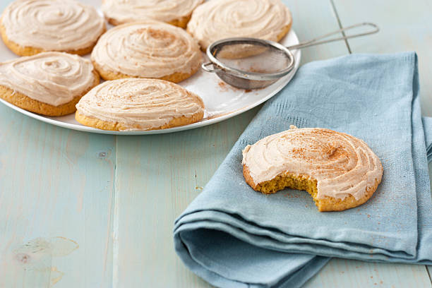 istock Pumpkin cookies with cream cheese frosting 472539440