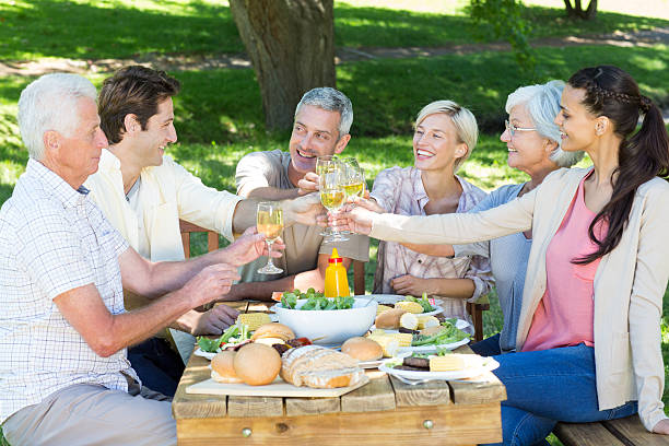 istock Happy family toasting in the park 472540984