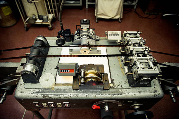 Audio video industrial film synchronizer for movie post producti Audio video industrial film synchronizer for movie post production in old factory, vintage movie processing in synch stock pictures, royalty-free photos & images