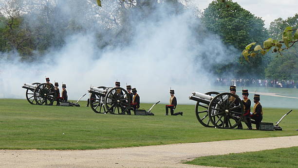 London, UK - May 4, 2015: Members of the King's Troop Royal Horse Artillery fire a 41-gun royal salute marking the birth of the Duke and Duchess of Cambridge's baby princess, in Hyde Park, London