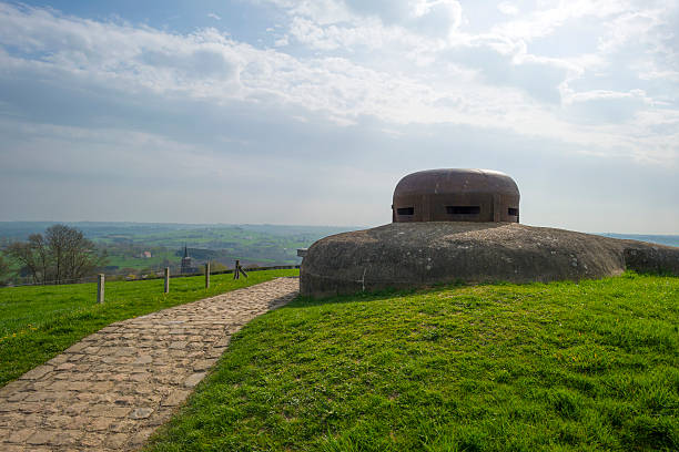 istock Belgian bunker from WW II under a blue cloudy sky 472542238