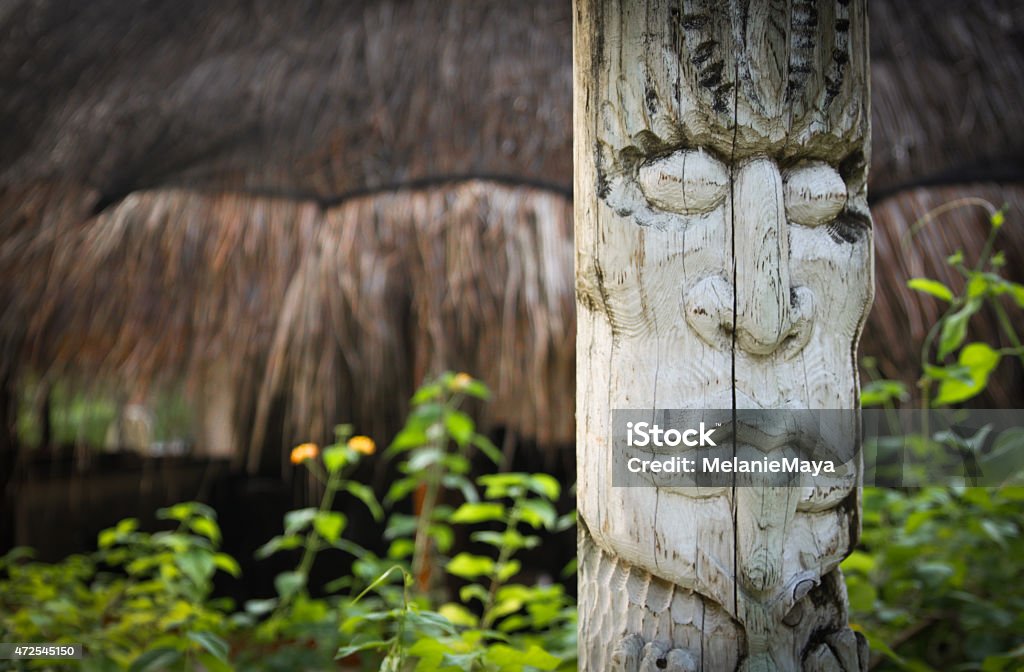 Exotic Wooden Totem Exotic wooden hand crafted totem in the bushes Pacific Northwest Stock Photo