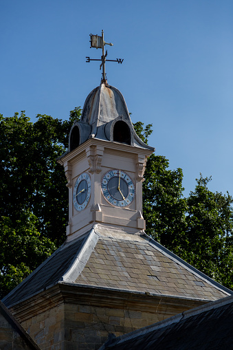 Clock tower with a wind vane