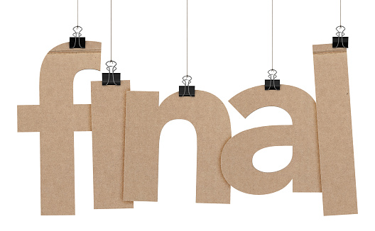 A  3D representation of the word final hanging on a plain white background. The word is hanging from binder paper clips that are attached to a piece of string. The letters have a cardboard texture. The background is pure white.