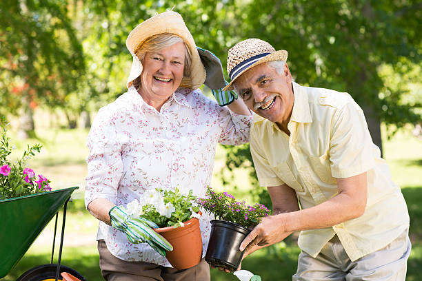 istock Happy senior couple gardening 472547152