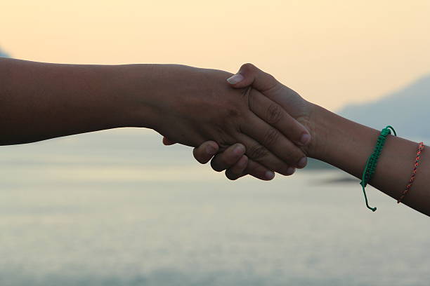 istock Hand signs and the evening sky. 472547772