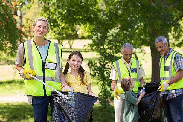 istock Happy family collecting rubbish 472548802