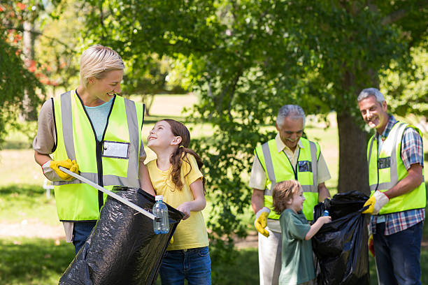istock Happy family collecting rubbish 472548804