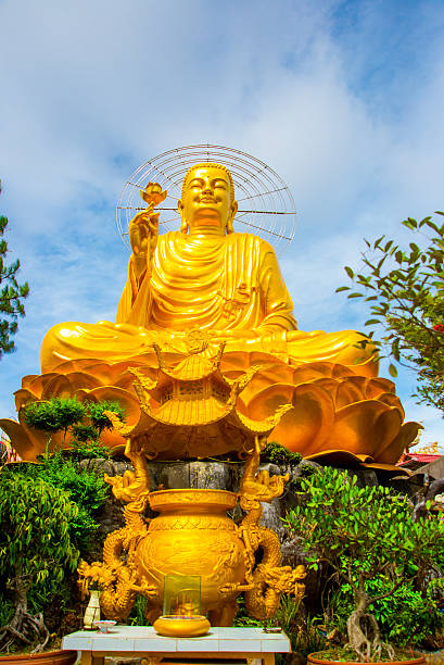 istock Religious monument, seated gold Buddha 472556182