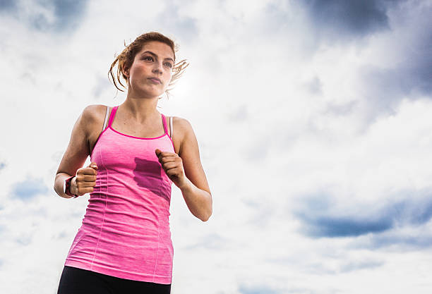 istock Exercising woman outdoors 472564020