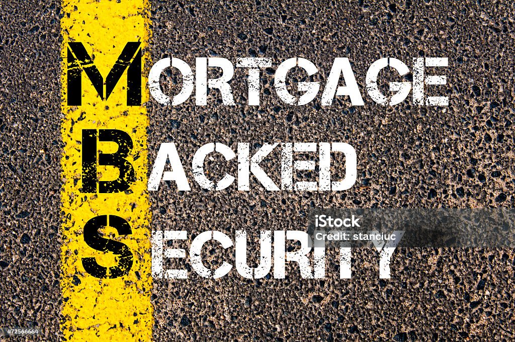 Business Acronym MBS - Mortgage Backed Security Business Acronym MBS - Mortgage Backed Security. Yellow paint line on the road against asphalt background. Conceptual image Mortgage Loan Stock Photo