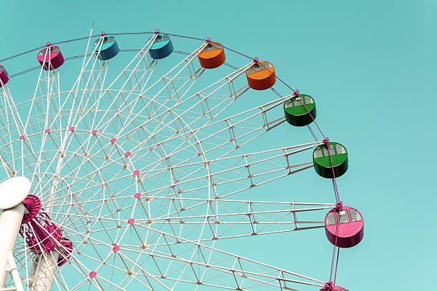 istock Giant ferris wheel against blue sky 472566960