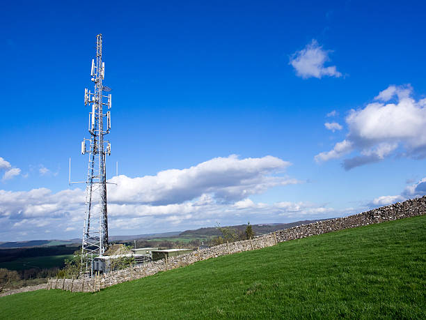 istock Cell phone communication mast in green field 472567322