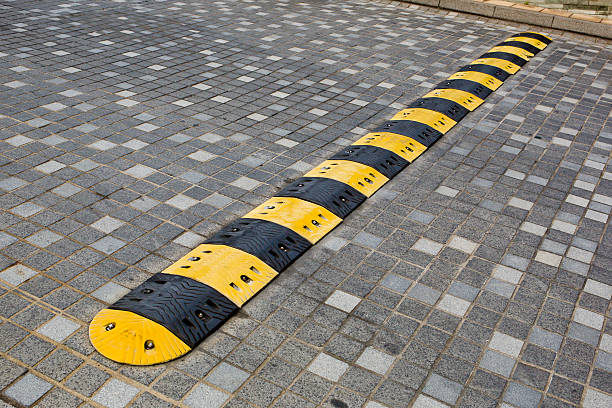 istock Traffic safety speed bump on an asphalt road 472572716