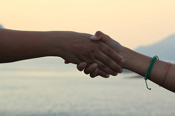 istock Hand signs and the evening sky. 472573514