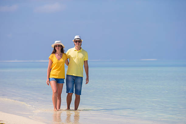 istock Young happy couple during beach tropical vacation 472576354