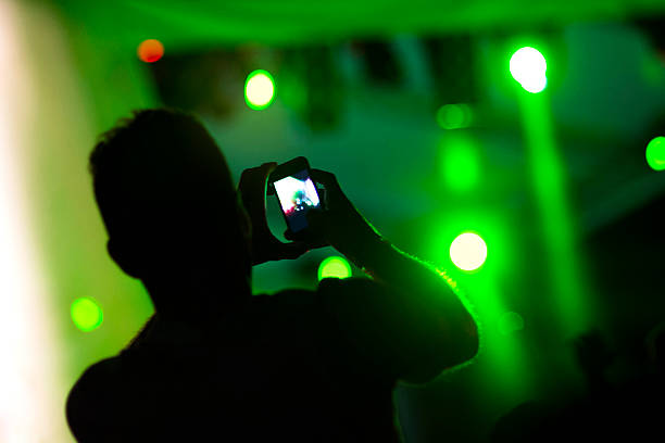 istock Taking pictures at the concert 472579332