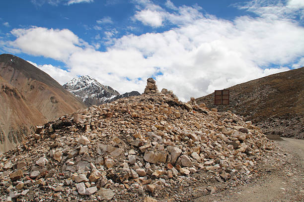 View of mountains and Mani Dui with the dramatic sky in Tibet, China