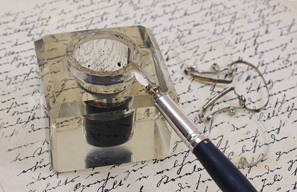 istock background with retro ink pen on old aged handwriteln letter 472580028