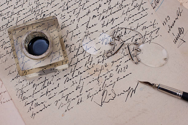 istock background with retro ink pen on old aged handwriteln letter 472580048