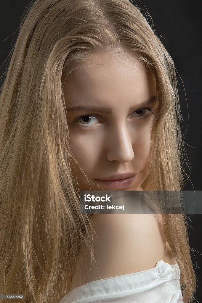 pretty pensive girl pretty pensive girl looking over naked shoulder 20-24 Years Stock Photo
