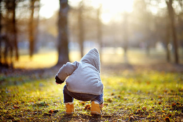 istock Toddler boy playing outdoors 472580820