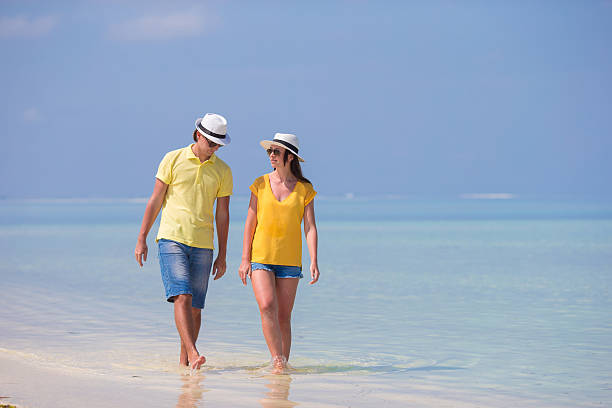 istock Young happy couple during beach tropical vacation 472581046