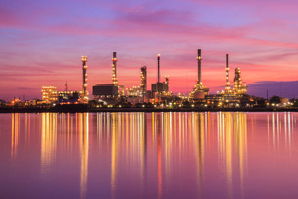 istock Oil refinery along the river at Dusk 472581624