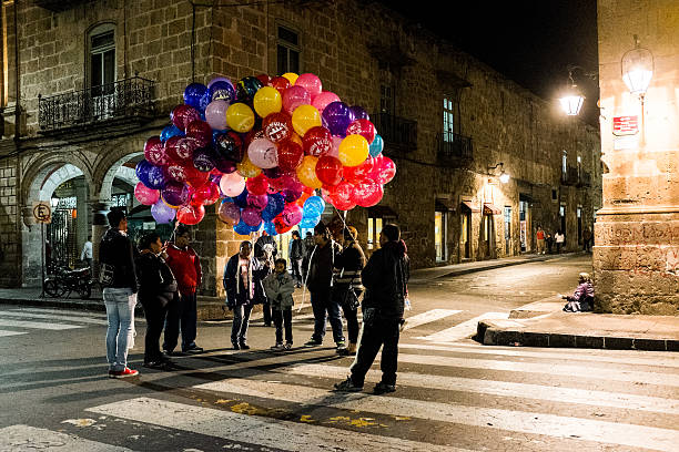San Cristobal de las Casas, Chiapas / Mexico - 21/07/2019:  Man selling balls in the main square of San Cristobal Chiapas