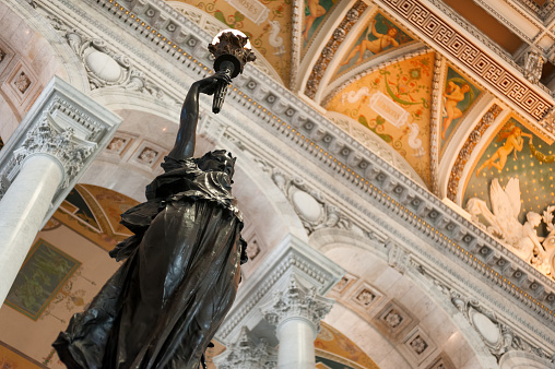 Washington DC, US - April 4, 2015: Interior of the Library of Congress (Capitol Hill) - the largest library in a world. Beautiful ceiling, columns and statue of freedom