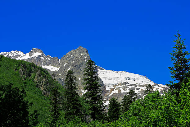 istock Caucasus Mountains Under Snow And Clear Blue Sky 472589274