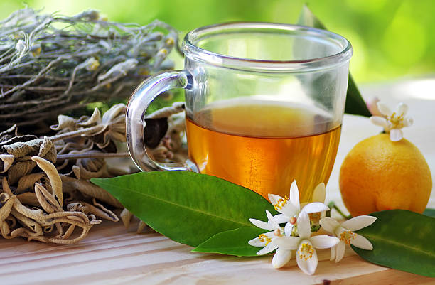 istock cup of herbal tea and lemon on table 472592696