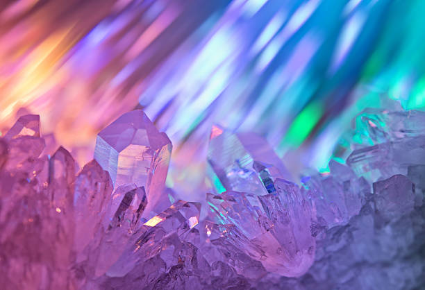 Unusual background with jewels. Sparkling multi-colored background with rays of light and crystals of rock crystal. crystal stock pictures, royalty-free photos & images
