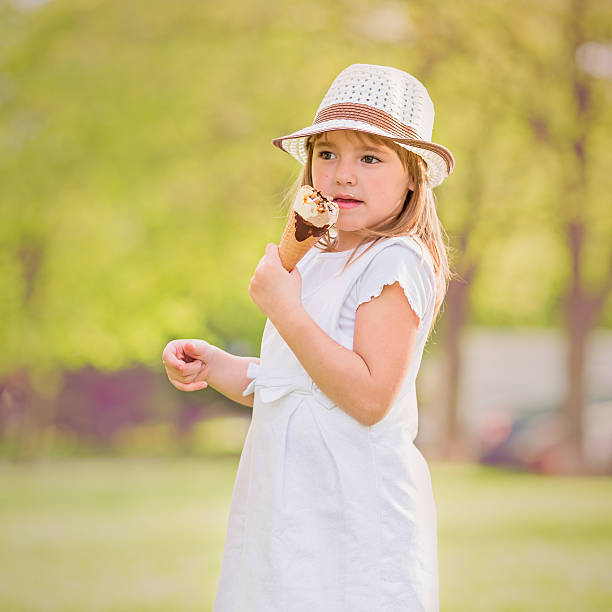 istock Little girl with ice cream 472595630