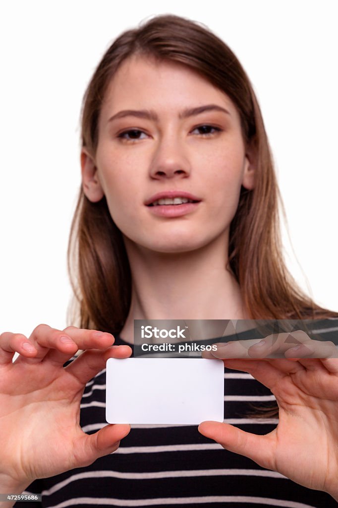 Cute Beautiful Woman Showing Blank Business Card Stock Image Cute Beautiful Woman Showing Blank Business Card, smiling and looking at camera - Stock Image 20-24 Years Stock Photo