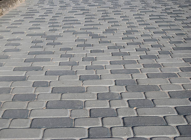 istock texture of grey cobblestone road 472595996