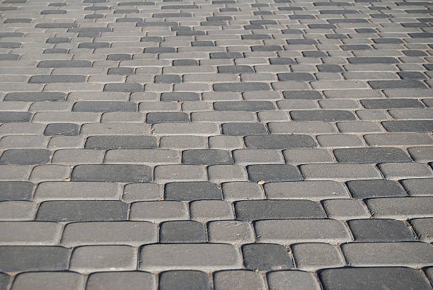istock texture of grey cobblestone road 472595998