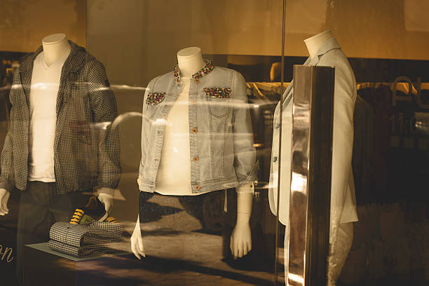 istock Color dresses and suits on mannequins in mall 472596340