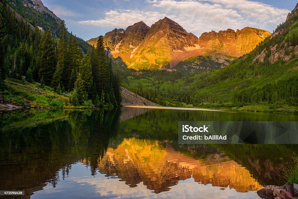 Sunrise at Maroon bell Sunrise at Maroon bell with reflection in water Colorado Stock Photo