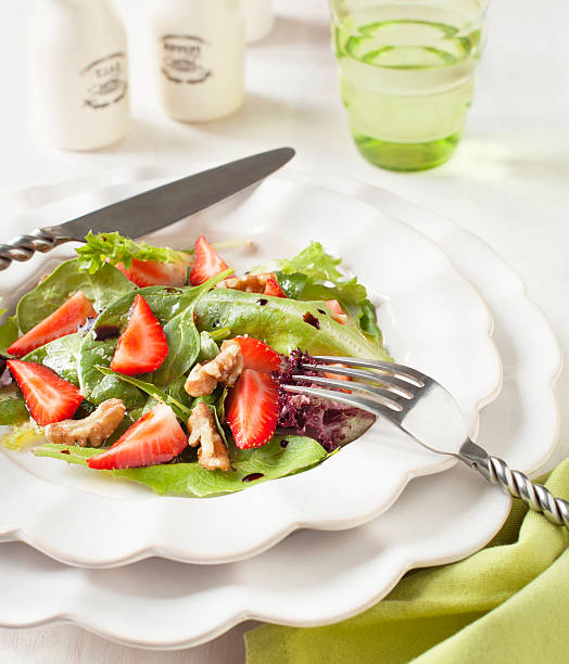 istock Green salad with strawberry 472596534