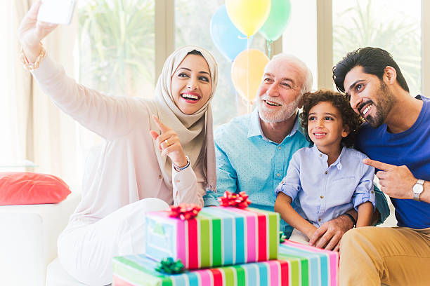 istock Three generation family celebrating a birthday in Dubai. 472597068