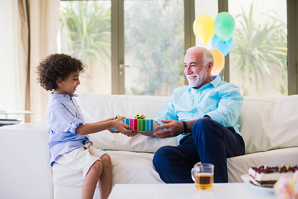 istock Three generation family celebrating a birthday in Dubai. 472597090