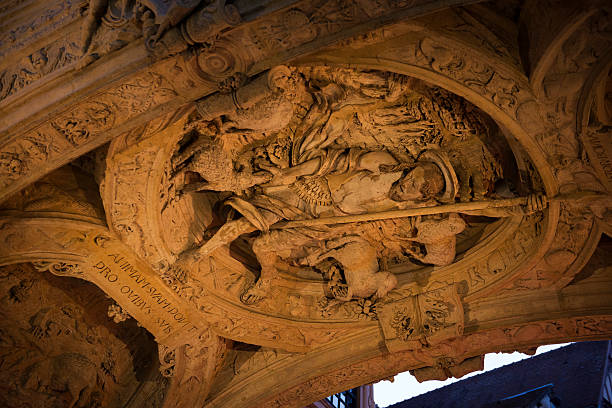 Good Shepherd carving in arch of Rouen's clock tower A carving of the Good Shephered in the arch of the Gros Horloge (Great Clock) in the heart of Rouen, France. rue du gros horloge photos stock pictures, royalty-free photos & images