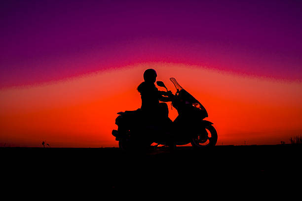 istock Sunset women and bike 472604468