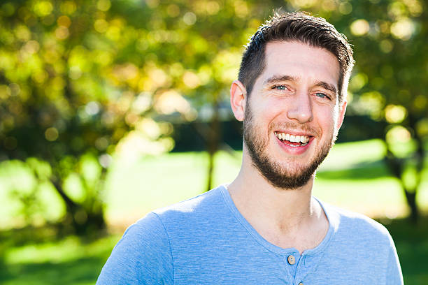 istock Young man is having fun in park 472608572
