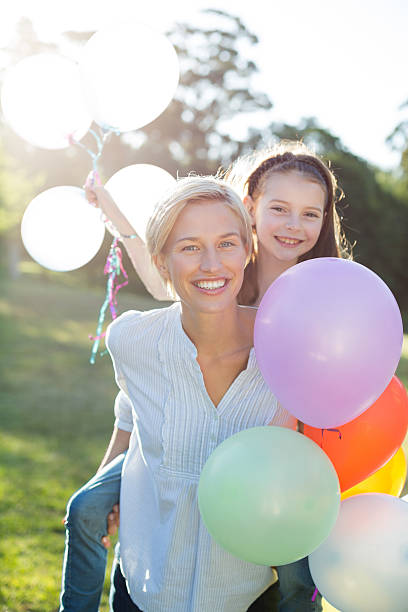 istock Happy mother playing with her daughter 472609506