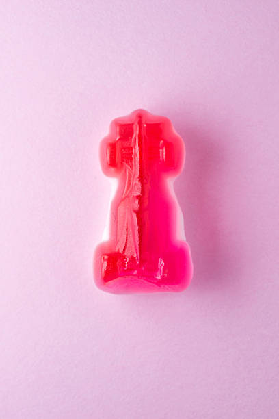 istock Red car candy on pink paper 472610554