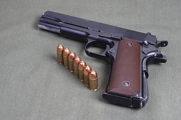 istock background with colt government m1911 472611170