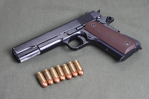 istock background with colt government m1911 472611184